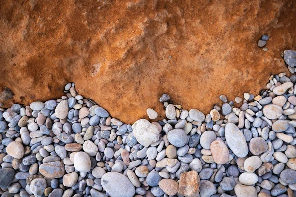 The erosion of water on the rocks, textures and patterns generated on the stones of the beach Ibiza island.