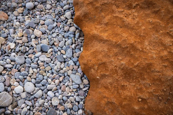 The erosion of water on the rocks, textures and patterns generated on the stones of the beach Ibiza island.