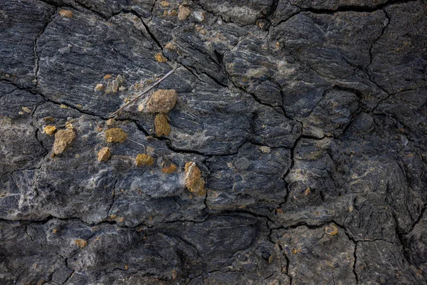 The erosion of water on the rocks, textures and patterns generated on the stones of the beach Ibiza island.