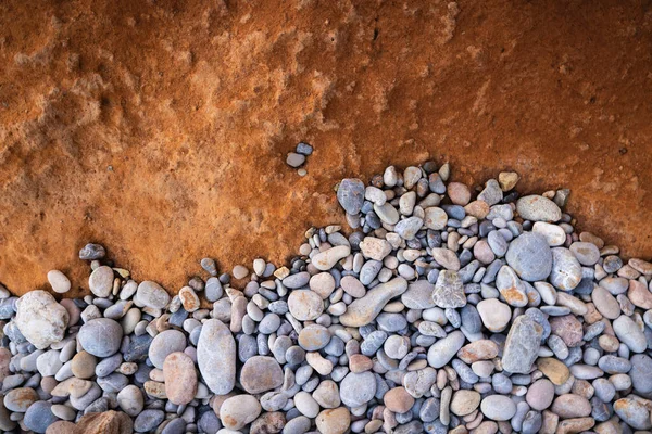 The erosion of water on the rocks, textures and patterns generated on the stones of the beach Ibiza island.