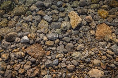 The erosion of water on the rocks, textures and patterns generated on the stones of the beach Ibiza island.