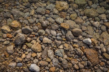 The erosion of water on the rocks, textures and patterns generated on the stones of the beach Ibiza island.