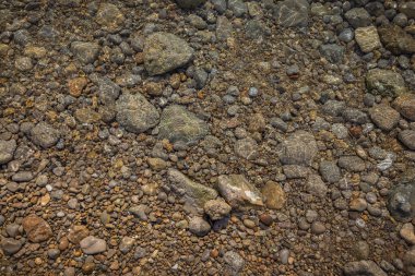 The erosion of water on the rocks, textures and patterns generated on the stones of the beach Ibiza island.