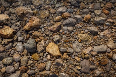 The erosion of water on the rocks, textures and patterns generated on the stones of the beach Ibiza island.