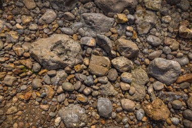 The erosion of water on the rocks, textures and patterns generated on the stones of the beach Ibiza island.