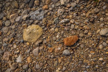 The erosion of water on the rocks, textures and patterns generated on the stones of the beach Ibiza island.
