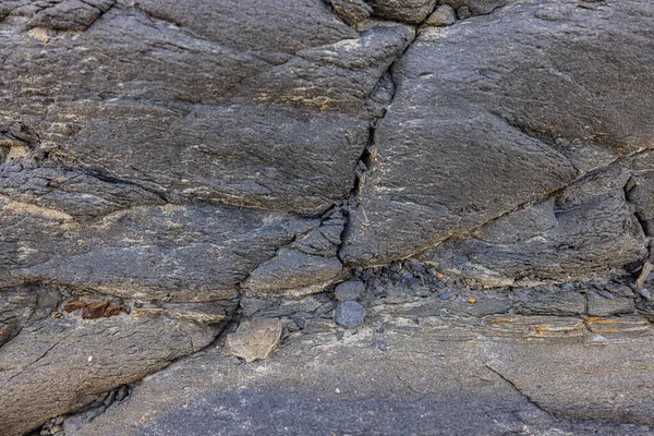 The erosion of water on the rocks, textures and patterns generated on the stones of the beach Ibiza island.