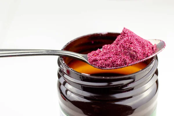 stock image beetroot powder in spoon with plastic jar or instant borsch