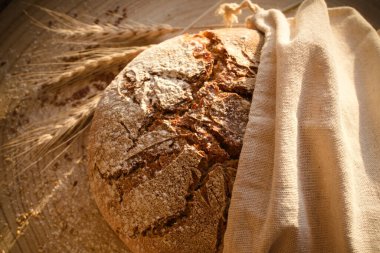 close up fresh rye bread with flour and seeds (version 3)