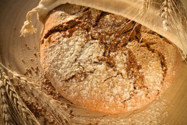 close up fresh rye bread with flour and seeds (version 1)
