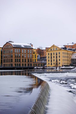 The river Motala Strom (Strommen) by old industrial buildings, a landmark of Norrkoping, Sweden