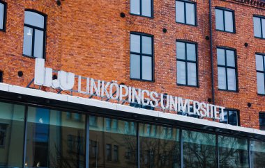 Linkopings Universitet (Linkoping University) logo on old brick building in Campus Norrkoping