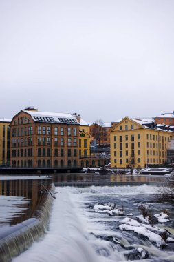 The river Motala Strom (Strommen) by old industrial buildings, a landmark of Norrkoping, Sweden