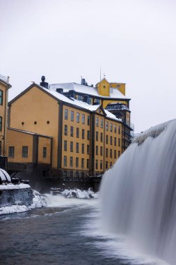 The river Motala Strom (Strommen) by old industrial buildings, a landmark of Norrkoping, Sweden