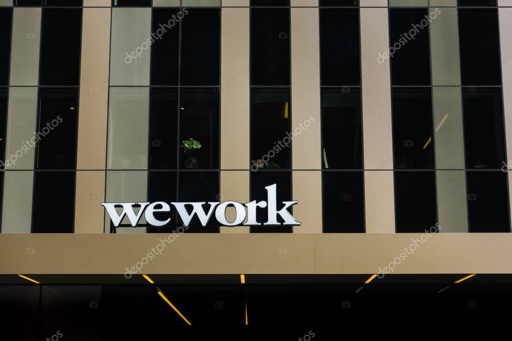 Stockholm, Sweden - 4 May 2023: WeWork logo on modern office building in urban city environment