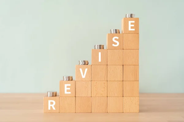 Wooden Blocks Revise Text Concept Coins — Stock Photo, Image