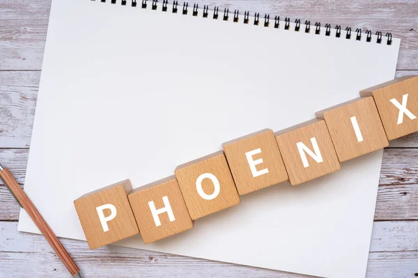 Phoenix 概念文本 钢笔和笔记本的木块 — 图库照片