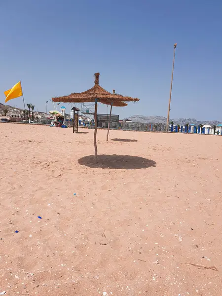 stock image This photo shows Rincon Beach in Tetouan, Morocco. The beach is a beautiful stretch of golden sand. The photo was taken in the morning, and the sun is shining brightly