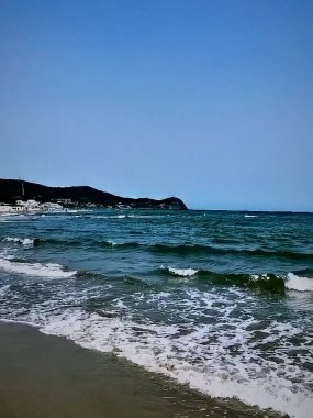 Okyanusun ritmi, Sonsuz Mavi Deniz Dalgaları 'nı kucaklamak.