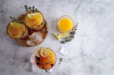 Fresh juicy cocktails with ice, orange juice and grenadine syrup copy space 