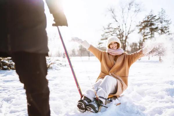 Man Rolls Woman Sled Winter Snowy Forest Cold Weather Holidays — Stock Photo, Image