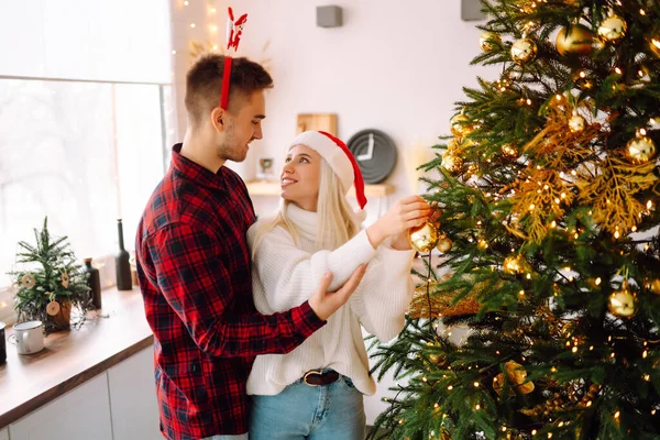 Young couple have Christmas surprise for holiday. Romantic day. Winter holidays.