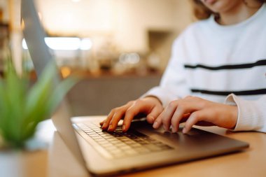 Close- up picture of female hands working on her laptop. Social networking technology concept. Technology, Freelance, online course, remote work and lifestyle concept
