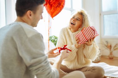 Exchange of gifts. Romantic day together. Valentines day, couple, relationships and people concept.