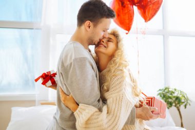 Exchange of gifts. Romantic day together. Valentines day, couple, relationships and people concept.