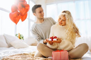 Exchange of gifts. Romantic day together. Valentines day, couple, relationships and people concept.