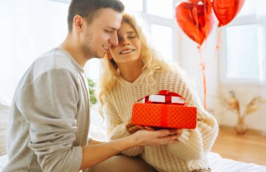 Exchange of gifts. Romantic day together. Valentines day, couple, relationships and people concept.