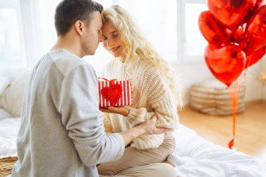 Exchange of gifts. Romantic day together. Valentines day, couple, relationships and people concept.