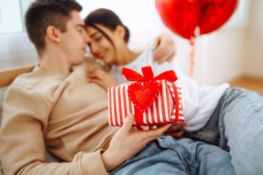 Exchange of gifts. Romantic day together. Valentines day, couple, relationships and people concept.
