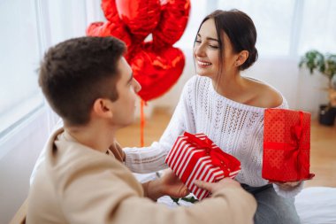 Exchange of gifts. Romantic day together. Valentines day, couple, relationships and people concept.