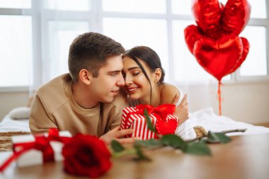 Exchange of gifts. Romantic day together. Valentines day, couple, relationships and people concept.