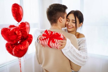 Exchange of gifts. Romantic day together. Valentines day, couple, relationships and people concept.