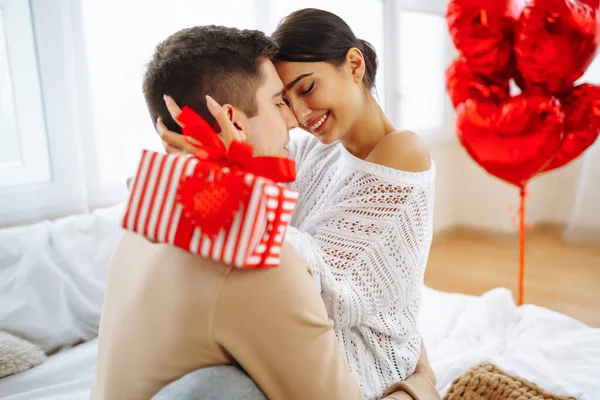 Exchange of gifts. Romantic day together. Valentines day, couple, relationships and people concept.