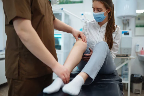 Doctor Examining Female Patient Injured Leg Osteopathy Chiropractic Leg Adjustment — Stock Photo, Image