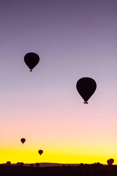 stock image Flying hot air balloons rise in sunrise Cappadocia. Goreme National Park Turkey.