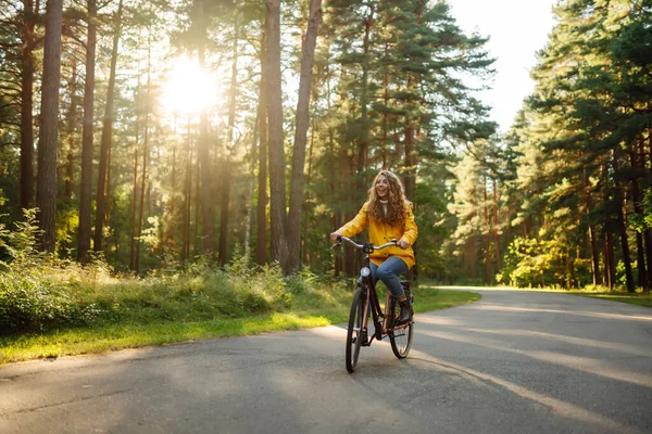 Young Woman Yellow Coat Riding Bicycle Park Active Day — Stock Photo, Image