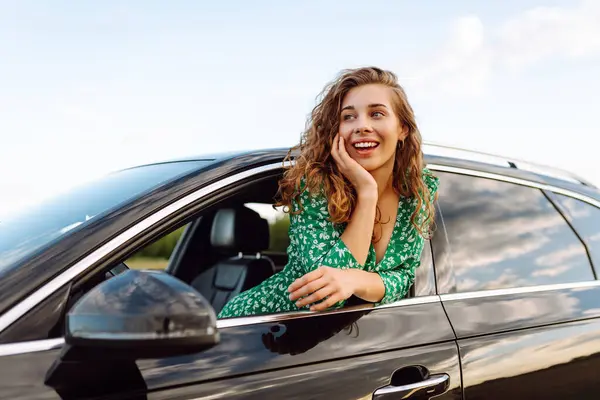 Happy Woman While Sticking Out Car Window Enjoying Travel Freedom Stock Picture