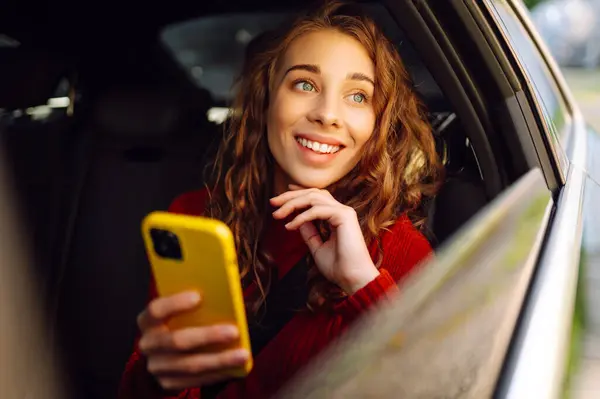 Young Woman Sits Back Seat Car Talks Phone Concept Business Imagem De Stock