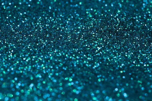 Turquoise glitter background texture.