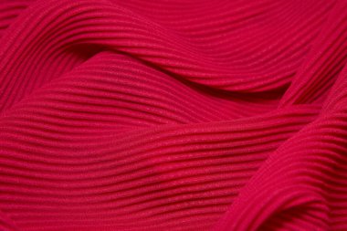 Pink fabric background. Pink cloth waves background texture. Pink fabric cloth textile material.