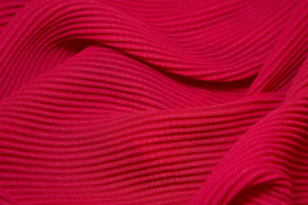 Pink fabric background. Pink cloth waves background texture. Pink fabric cloth textile material.