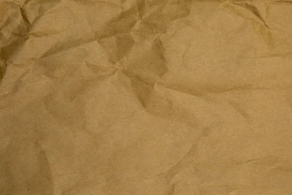 Brown wrinkle paper background texture. Brown template. Brown paper background.