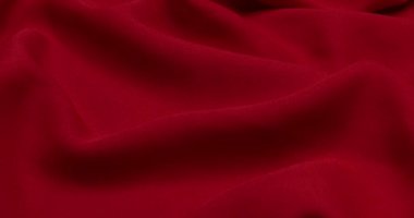 Kırmızı kumaş arka plan. Kırmızı bez dalgaları arka plan dokusu. Kırmızı kumaş kumaş kumaş kumaş..