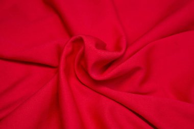 Kırmızı kumaş arka plan. Kırmızı bez dalgaları arka plan dokusu. Kırmızı kumaş kumaş kumaş kumaş..