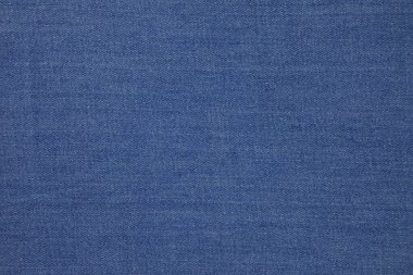 Blue jeans fabric background texture. Blue jeans fabric cloth textile material.