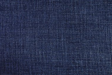 Blue jeans fabric background texture. Blue jeans fabric cloth textile material.